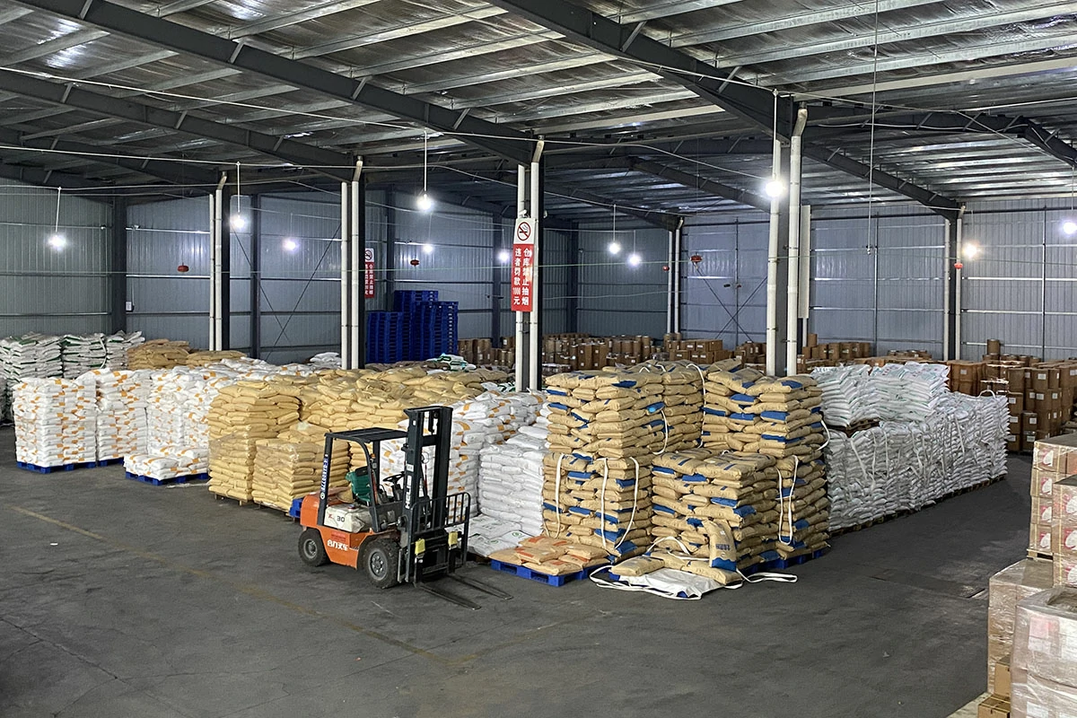 Anrui Biotech warehouse with large stock of food ingredients and forklift operation, highlighting strong inventory and fast delivery capability.