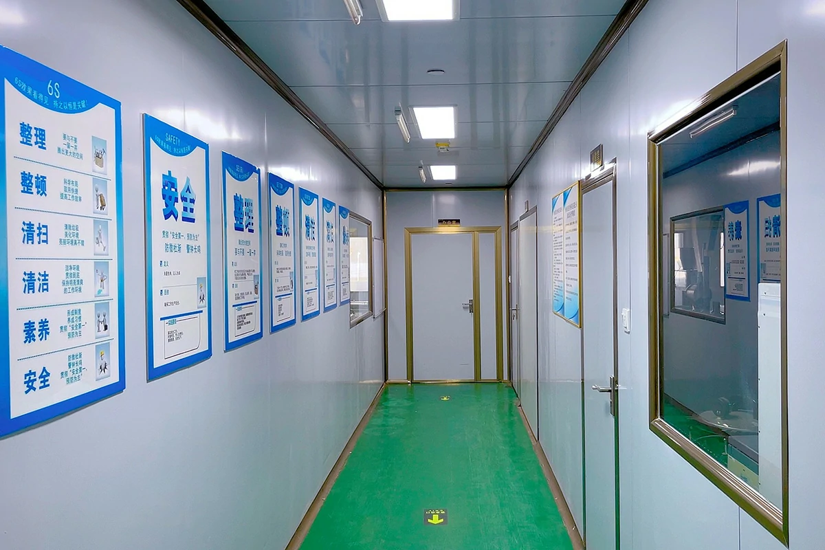 Anrui Biotech factory corridor with 6S management and safety posters, highlighting strict quality system and standardized production environment.